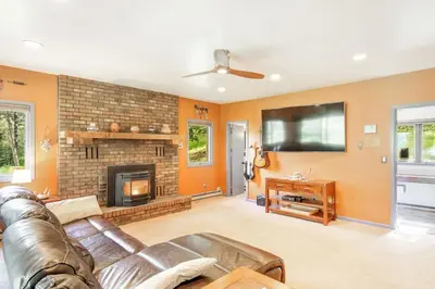 a living room with a couch and a fireplace at The Four Pines Near to Red Rocks And Morrison in Morrison