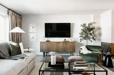 a living room with a couch and a tv at Luxe Home with Hot Tub Movie Room and Firepit Near Denver in Arvada