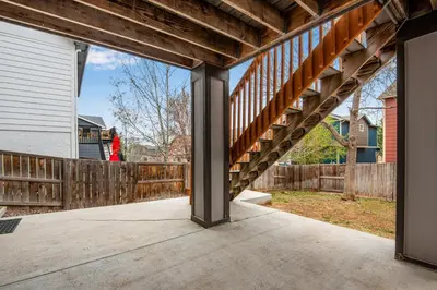 a porch with a wooden stairway in a home at 5 bed 4 bath and Pet friendly in Erie