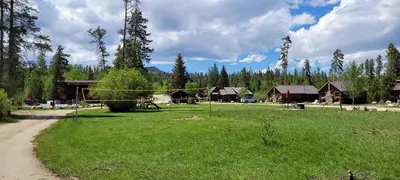 a park with a volleyball net in a field at Colorado Cabin Adventure in Grand Lake