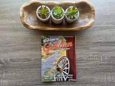 a book and threeotted plants on a wooden plate at 10 min Red Rocks & FAMILY FRIENDLY & 7min to I70 & STR-25-0008 in Golden