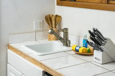 a kitchen counter with a sink in a kitchen at 5 Bedroom Whole Home with Mountain Views in Evergreen