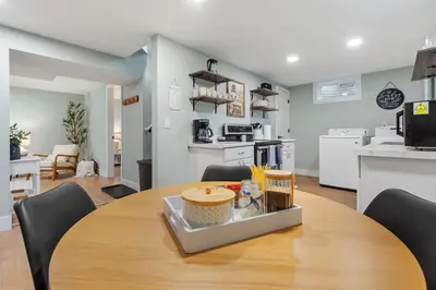 a kitchen and dining room with a table and chairs at 5Bed, 2Bath, 2 Kitchens, Home Office, Pet-Friendly in Denver