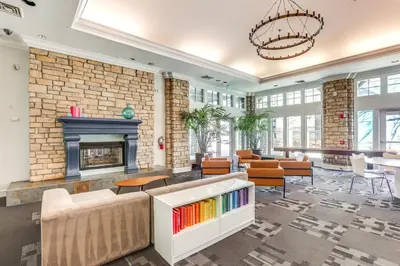 a living room with a fireplace and a couch at Less Than 1 Mi to Downtown Denver Condo with Pool Access! in Denver
