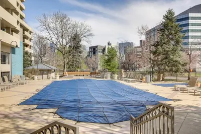 a blue blanket is laying on the ground at Less Than 1 Mi to Downtown Denver Condo with Pool Access! in Denver