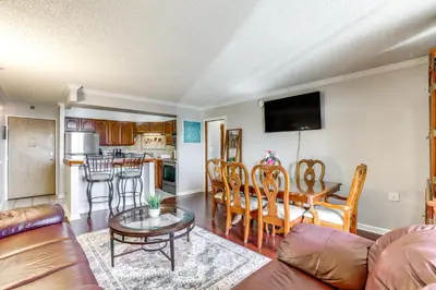 a living room with a couch and a table at Less Than 1 Mi to Downtown Denver Condo with Pool Access! in Denver