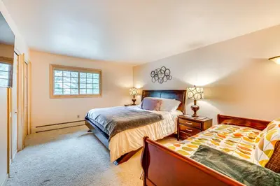 a bedroom with two beds and a window at 1 Mi to Rocky Mtn Natl Park Estes Park Townhome in Estes Park