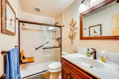 a bathroom with a toilet sink and a shower at 1 Mi to Rocky Mtn Natl Park Estes Park Townhome in Estes Park
