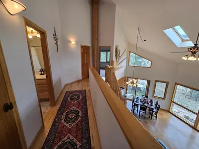 a staircase in a house with a rug on the floor at Moose Manor in Golden