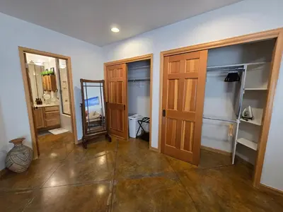 a room with two wooden doors and a mirror at Moose Manor in Golden