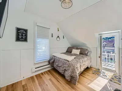 a bedroom with a bed and a window at Historic 4 bedroom Victorian Home in Downtown Georgetown in Georgetown