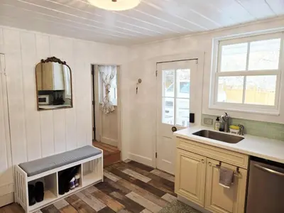 a kitchen with a sink and a window and a sink at Historic 4 bedroom Victorian Home in Downtown Georgetown in Georgetown