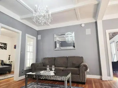 a living room with a couch and a table at Victorian Dream! Charming Mountain View Home by Downtown in Georgetown