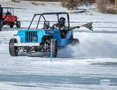 a man in a jeep in the snow at Charming Downtown Apartment in Victorian Home with Mountain Views in Georgetown