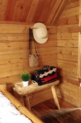 a wooden room with a bench in a cabin at Colorado Glamping Adventures in Golden Gate Canyon Park, in this Cute Cabin Rental in Black Hawk