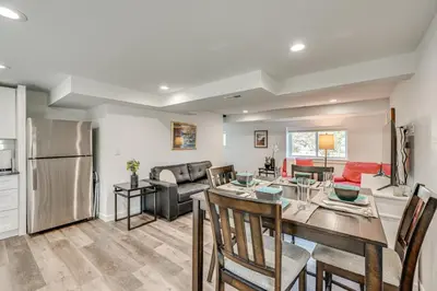 a kitchen and living room with a table and chairs at 14 Mi to Pearl Street Mall Erie Getaway in Erie