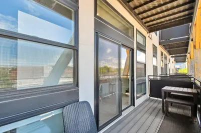 a balcony with a table and some windows at 2880(U306): Sunlit Escape in Denver