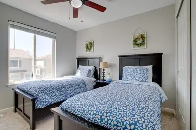 a bedroom with two beds and a window at La Casita with Private Yard 17 Mi to Dtwn Denver in Henderson