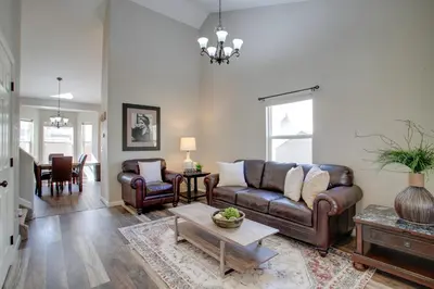 a living room with a couch and a table at La Casita with Private Yard 17 Mi to Dtwn Denver in Henderson