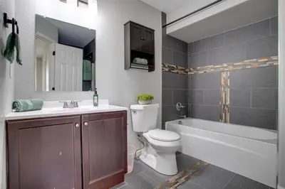 a bathroom with a toilet and a sink and a bath tub at La Casita with Private Yard 17 Mi to Dtwn Denver in Henderson