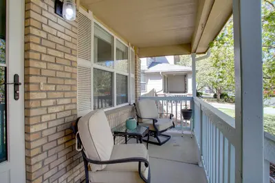 a porch with two chairs and a table at La Casita with Private Yard 17 Mi to Dtwn Denver in Henderson