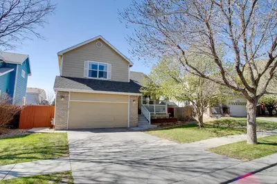 a house with a driveway and a garage at La Casita with Private Yard 17 Mi to Dtwn Denver in Henderson