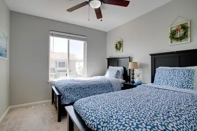 a bedroom with two beds and a window at La Casita with Private Yard 17 Mi to Dtwn Denver in Henderson