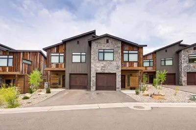 an exterior view of a house with a garage at Walk to Ski Lift Granby Ranch Family Retreat! in Granby