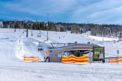 a ski slope with a ski lift in the snow at Walk to Ski Lift Granby Ranch Family Retreat! in Granby