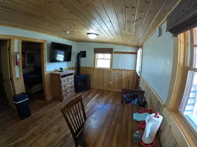 a dining room with a wooden table and chairs at Shadow Mountain in Grand Lake