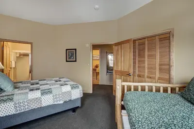 a bedroom with two beds and a closet at Fantastic Mountain Home Near Ski Lifts condo in Keystone