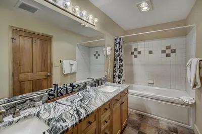 a bathroom with a tub and a sink and a tub at Fantastic Mountain Home Near Ski Lifts condo in Keystone