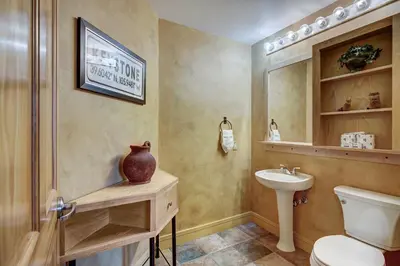 a bathroom with a toilet and a sink at Fantastic Mountain Home Near Ski Lifts condo in Keystone