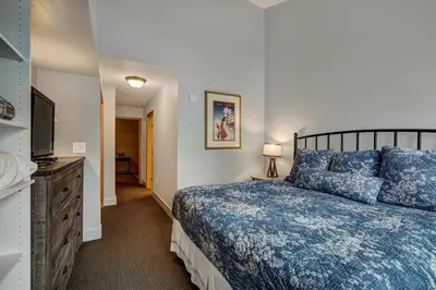 a bedroom with a bed and a flat screen tv at Fantastic Mountain Home Near Ski Lifts condo in Keystone