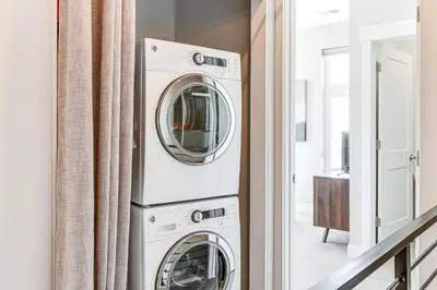a laundry room with a washer and dryer at Walk to Mile High Stadium Modern Denver Townhome in Denver