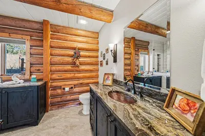 a bathroom with a sink and a toilet at The Broadmeadow Cabin - VR-25-0005 cabin in Lyons