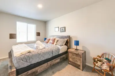 a bedroom with a bed and a window at 11 Mi to Fort Collins Wellington Retreat with Patio in Wellington