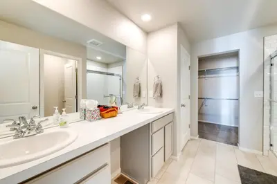 a bathroom with two sinks and a shower at 11 Mi to Fort Collins Wellington Retreat with Patio in Wellington