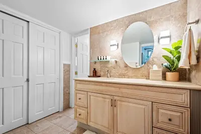 a bathroom with a sink and a mirror at Quiet Denver Hampden Neighborhood - Tech Center in Denver