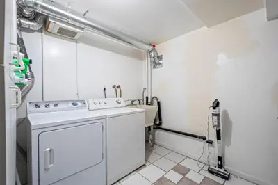 a laundry room with a washer and dryer at Quiet Denver Hampden Neighborhood - Tech Center in Denver
