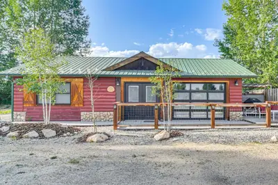 a small red house with a green roof at Modern Granby Retreat Fish, Hike and Relax! in Granby