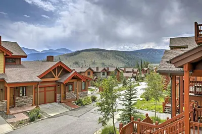 a row of houses with mountains in the background at Trailside Tranquility in Winter Park