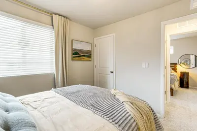 a bedroom with a bed and a window at 13 Mi to Dtwn Denver Spacious Home with Balcony! in Denver
