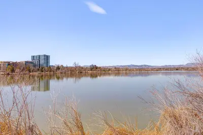 a large body of water with a city in the background at Southern Comfort at the Blue Door in Sloan Lake in Denver