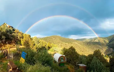 a rainbow over a gazebo in the mountains at Special Glamping Accommodation Ideal for Nature Lovers in Golden, Colorado in Golden