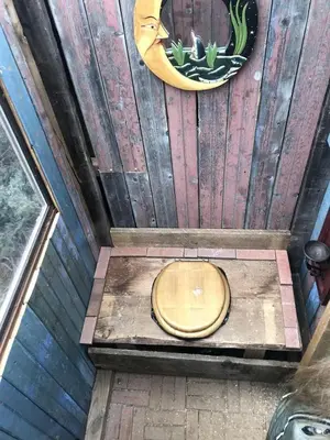 an overhead view of a toilet in a wooden wall at Special Glamping Accommodation Ideal for Nature Lovers in Golden, Colorado in Golden