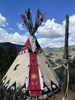 a tent with a tree on top of a mountain at Raven's Ridge Luxurious Tipi in Golden, Colorado in Golden