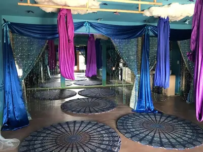 a dance floor with blue and purple drapes at Raven's Ridge Luxurious Tipi in Golden, Colorado in Golden