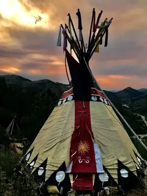 a kite that is sitting on top of a hill at Raven's Ridge Luxurious Tipi in Golden, Colorado in Golden