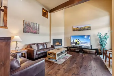 a living room with a couch and a fireplace at Spacious Ski Townhome with Game Room Fun in Breckenridge